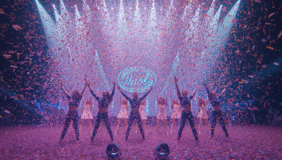 Energetic Performance with Confetti Shower on Stage