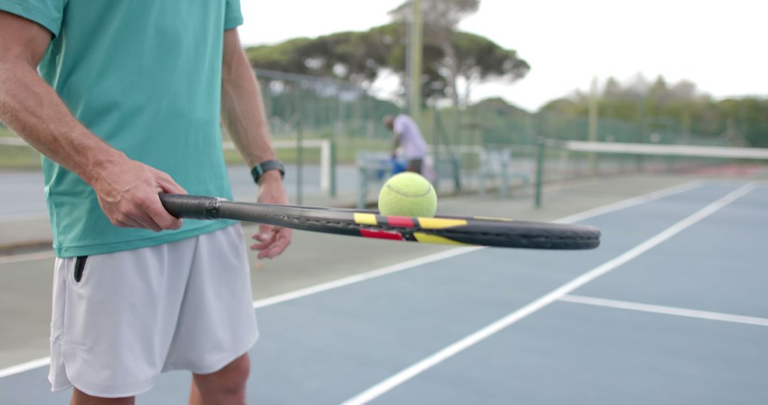 Close-up of Tennis Player Balancing Ball on Racket on Court - Free Images, Stock Photos and Pictures on Pikwizard.com