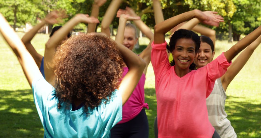 Outdoor Zumba Class Exercising in Sunny Park Atmosphere