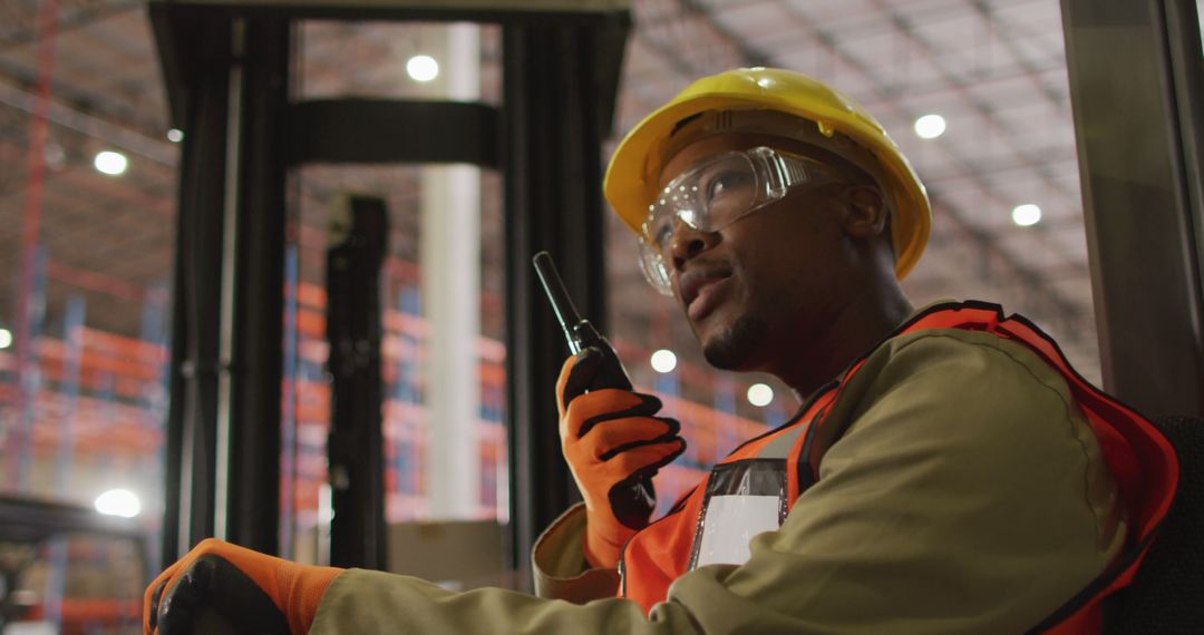 Warehouse Worker Communicating via Radio on Duty
