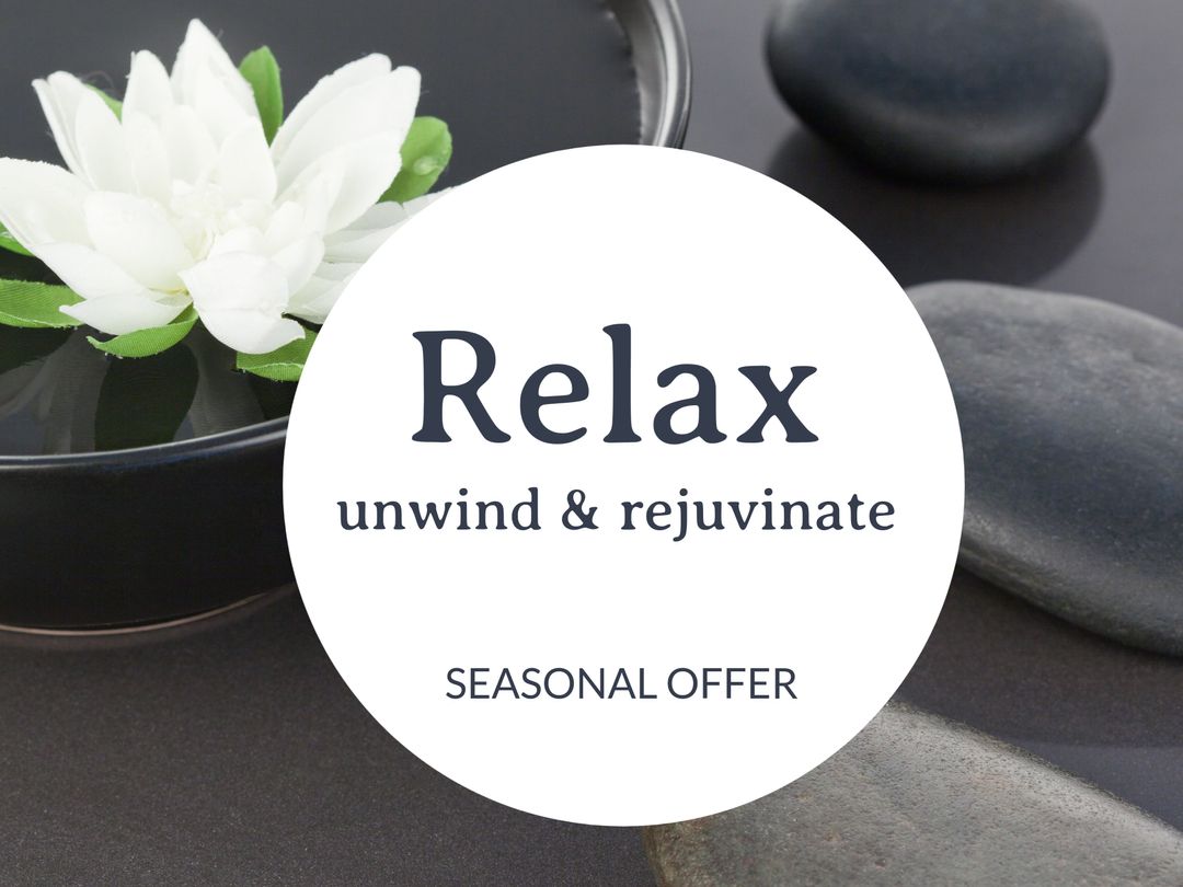 Serene Spa Ambiance with Smooth Stones and White Flower