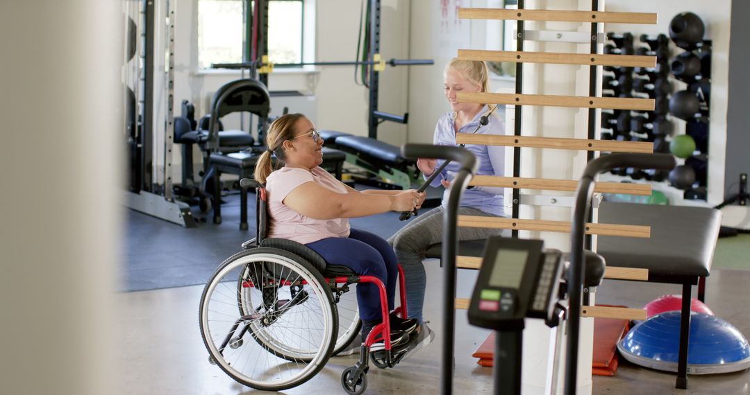 Woman in Wheelchair Undergoing Physio Session with Therapist at Gym