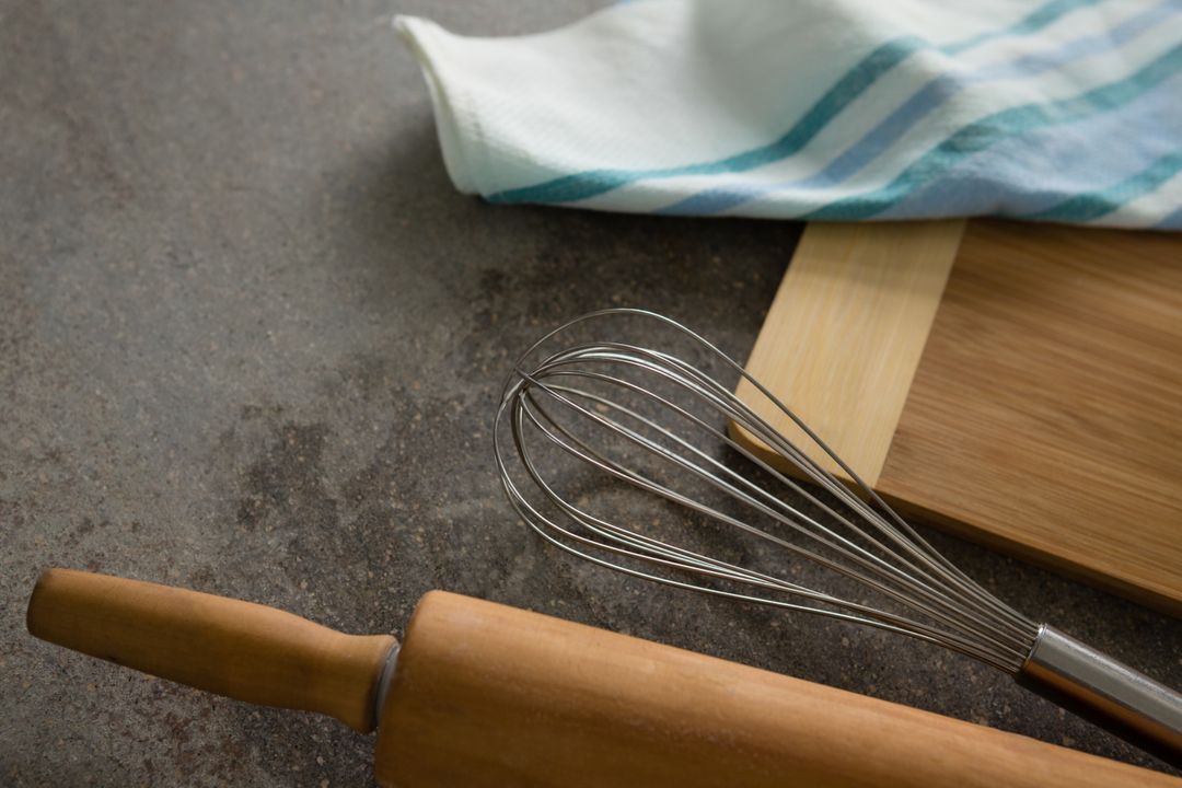 Kitchen Tools on Rustic Table Surface