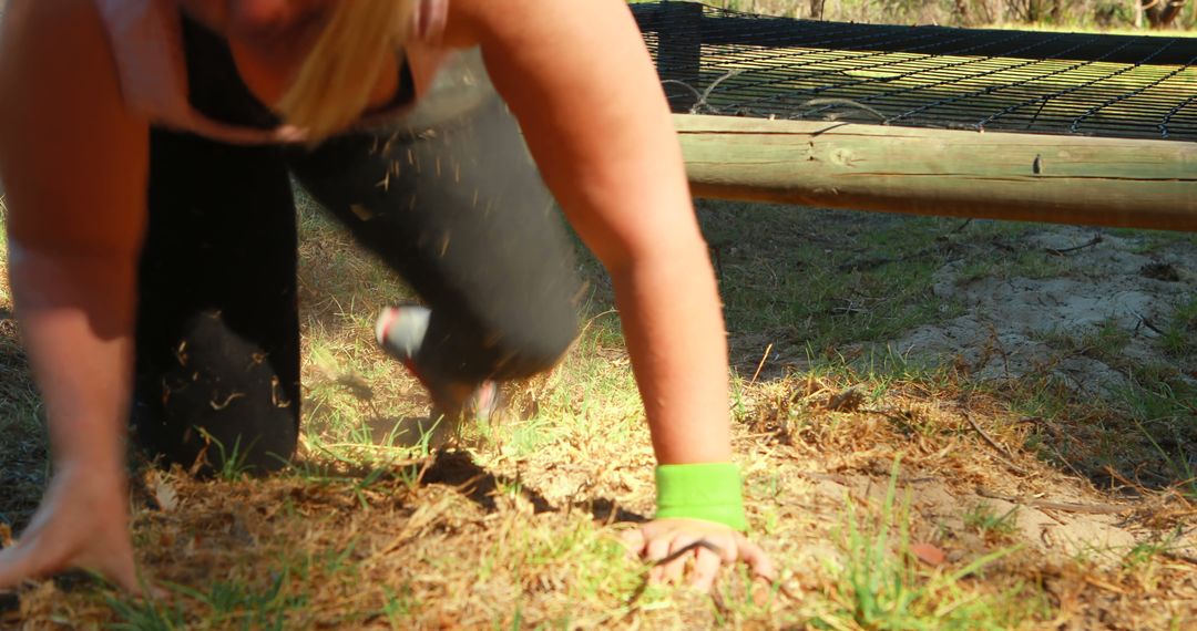 Woman Crawling Under Net During Obstacle Course Race - Free Images, Stock Photos and Pictures on Pikwizard.com