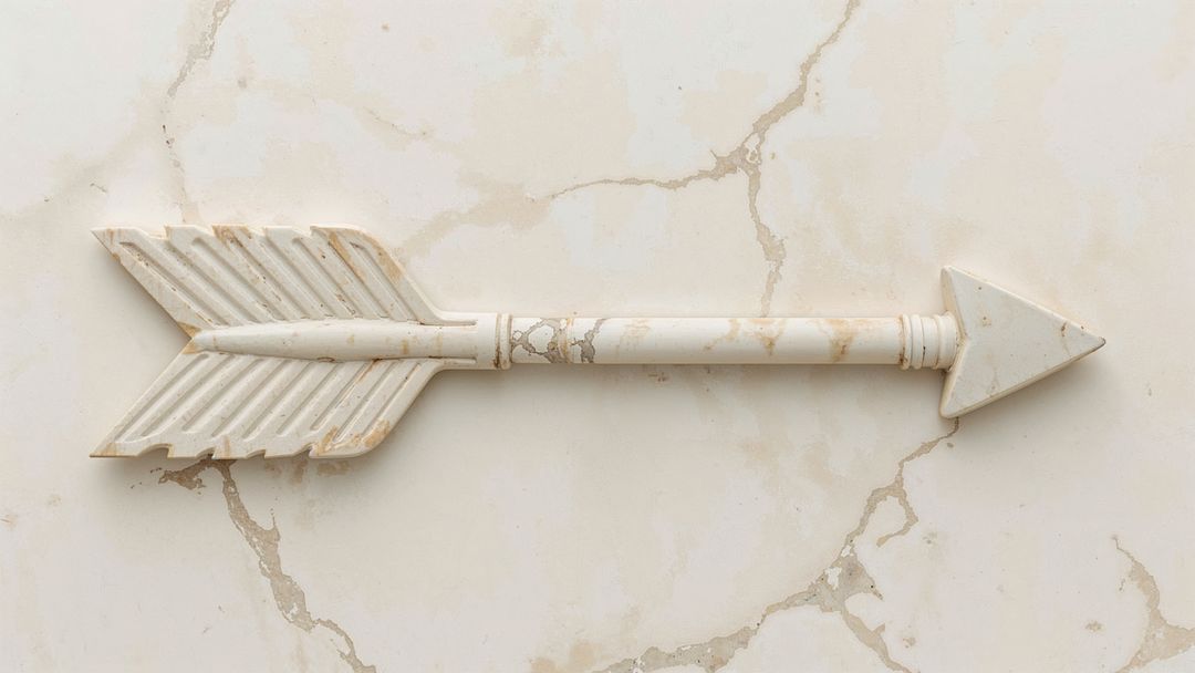 Decorative Arrow Resting on Marble with Textured Fletching