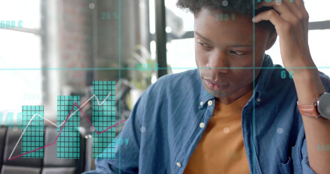 Focused Businessman Analyzing Complex Data Charts in Office