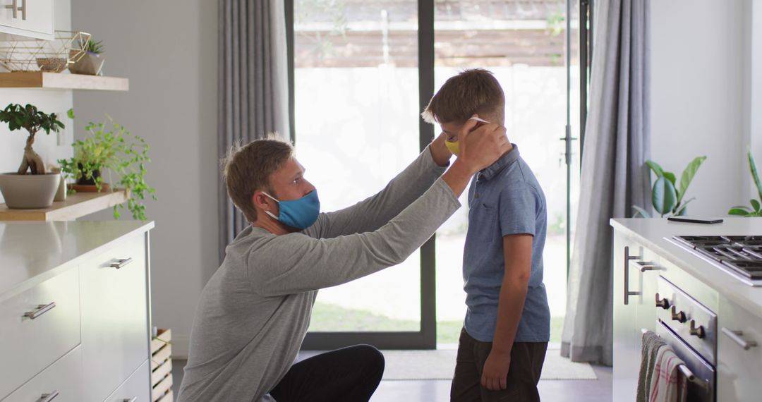 Father Helping Son Wear Face Mask at Home - Free Images, Stock Photos and Pictures on Pikwizard.com