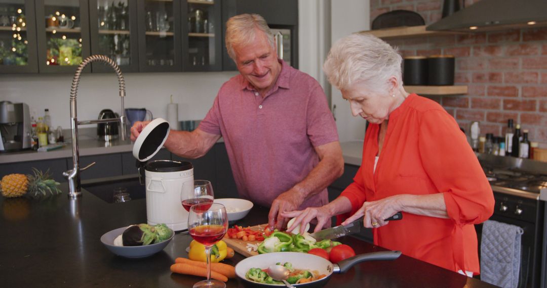 Senior Couple Preparing Dinner Together In Modern Kitchen - Free Images, Stock Photos and Pictures on Pikwizard.com