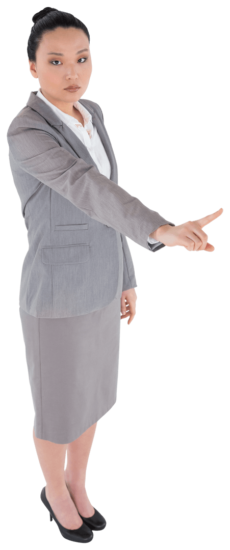 Serious Asian Businesswoman Pointing with Authority on Transparent Background