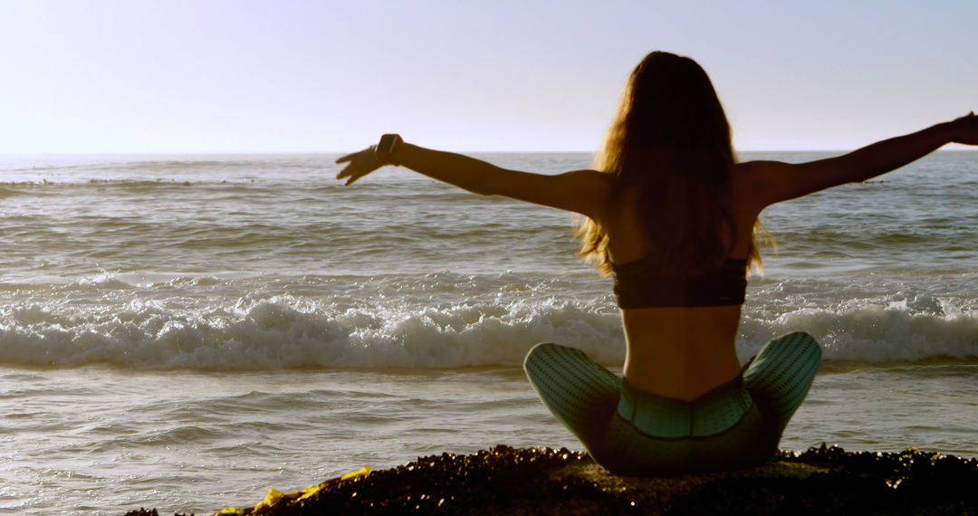 Woman Practicing Yoga by the Seaside during Sunset - Free Images, Stock Photos and Pictures on Pikwizard.com