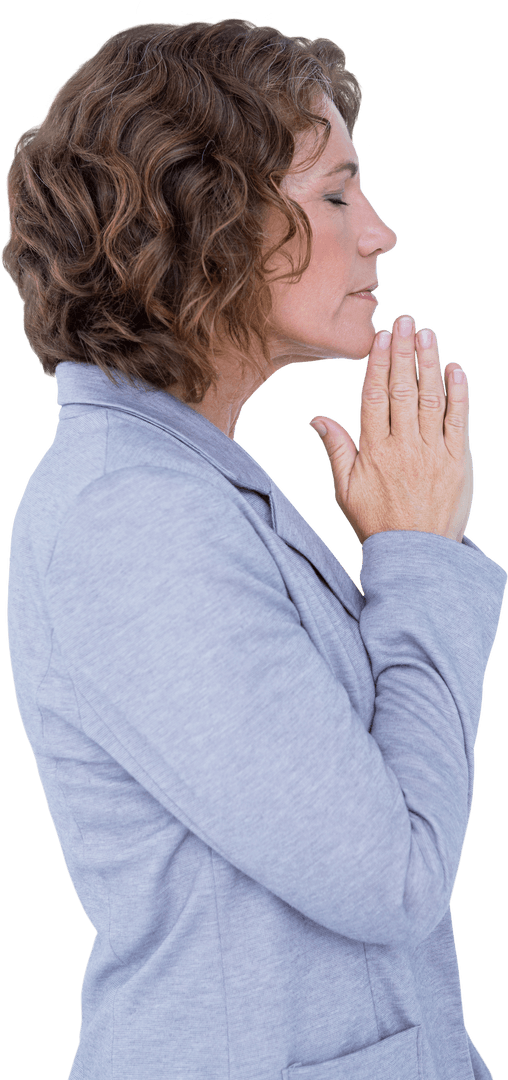 Woman with Joined Hands and Closed Eyes Showing Gratitude