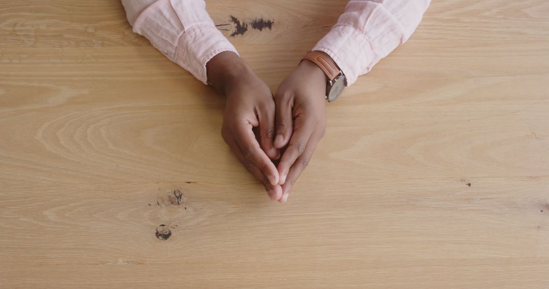 Expressive Hands at Wooden Desk: Professional Gestures of Motivation