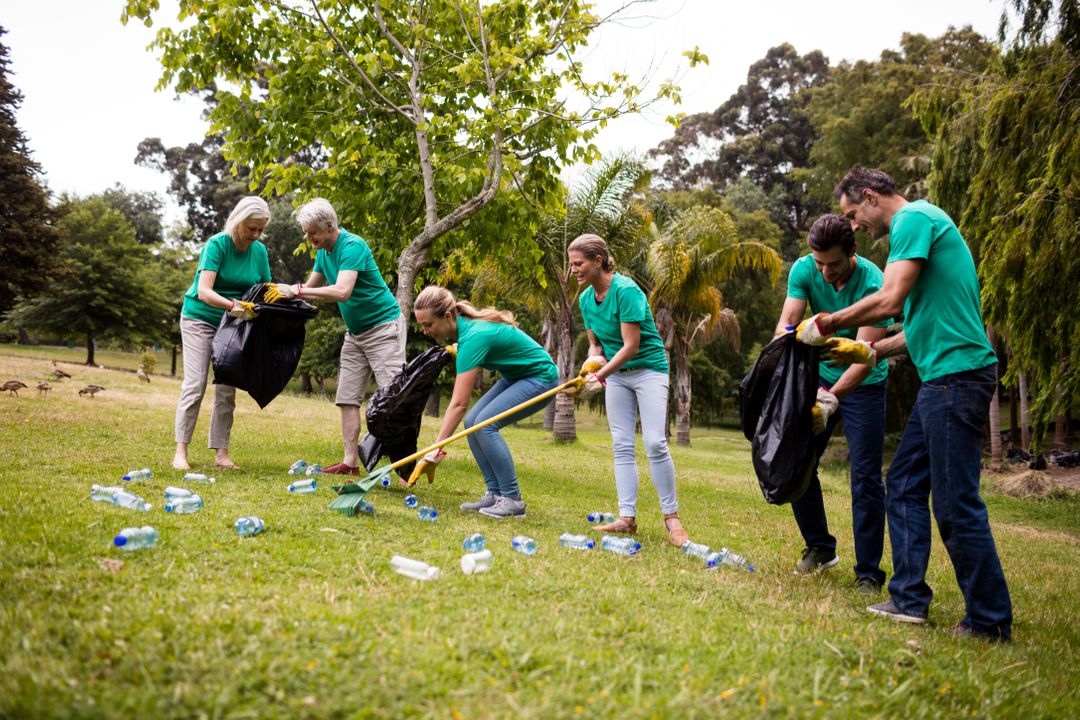 Team of volunteers picking up litter - Free Images, Stock Photos and Pictures on Pikwizard.com