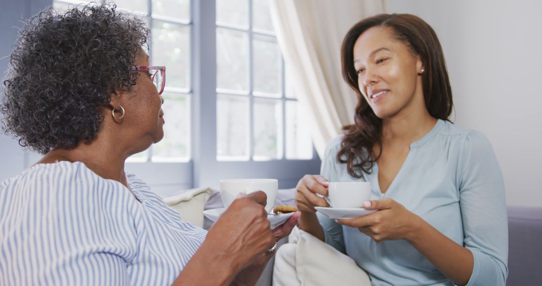 Senior Woman and Young Woman Sharing Coffee Together - Free Images, Stock Photos and Pictures on Pikwizard.com