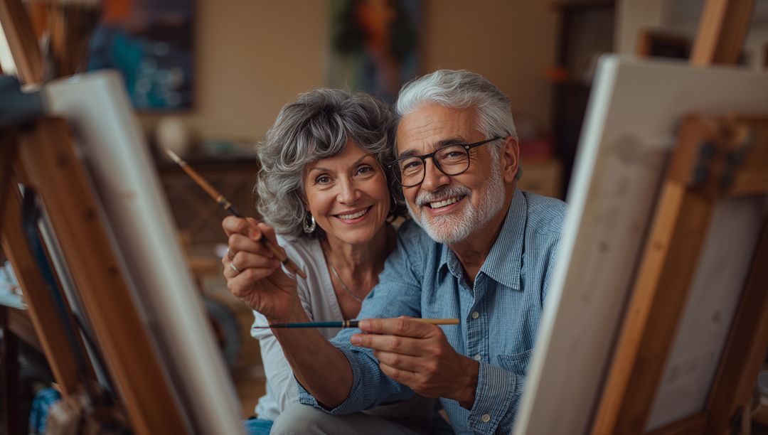 Senior Couple Painting Together in Warm Art Studio Sharing Joy and Creativity