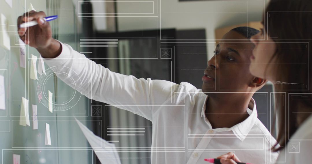 Collaborating team brainstorming on glass board with sticky notes and digital overlay