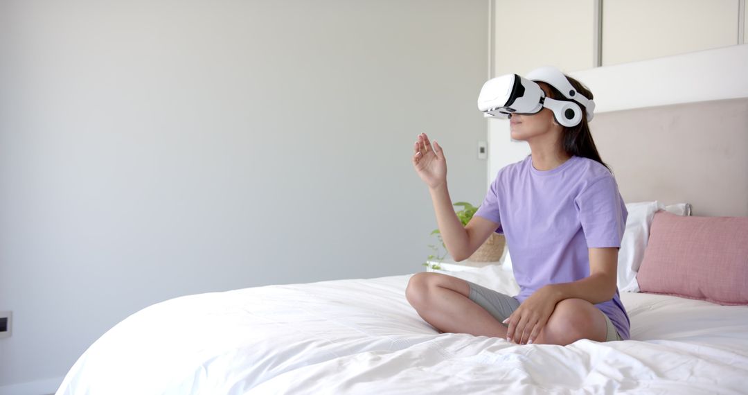 Woman Experiencing Virtual Reality Relaxation on Bed