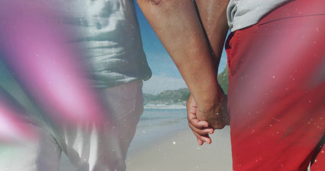 Couple Holding Hands Walking Beach on Sunny Day
