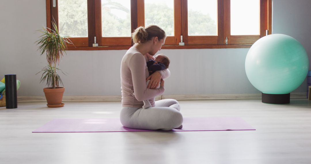 Image of caucasian mother and newborn baby on yoga mat - Free Images, Stock Photos and Pictures on Pikwizard.com