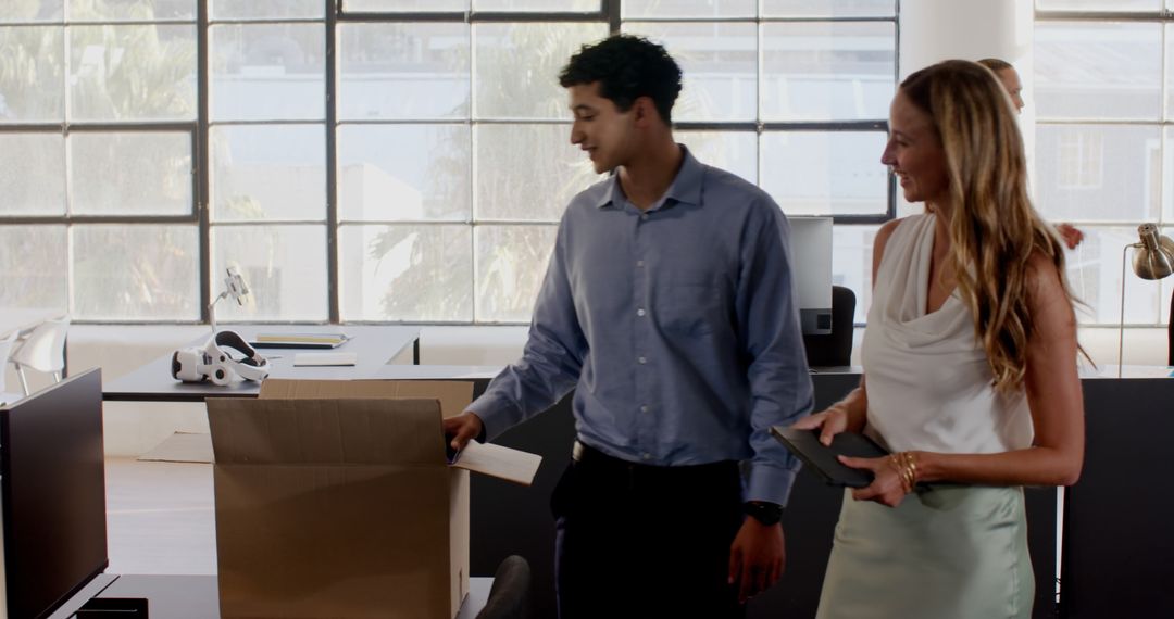 Professionals Organizing Office Workspace with Team Spirit