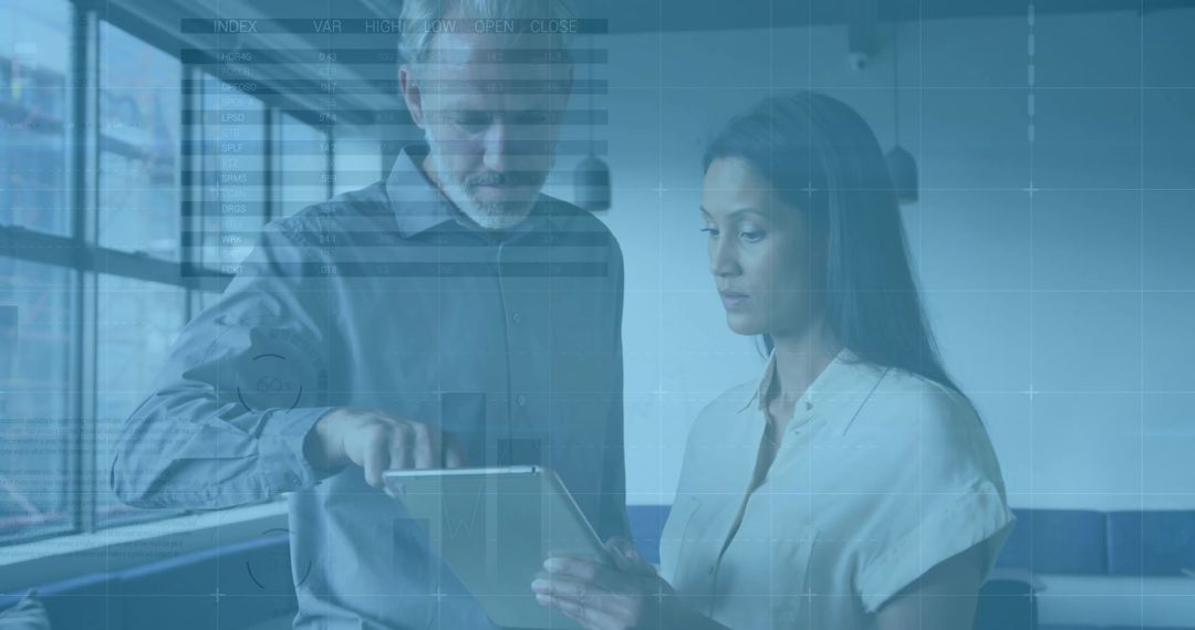 Professionals Collaborating in Modern Office on Tablet