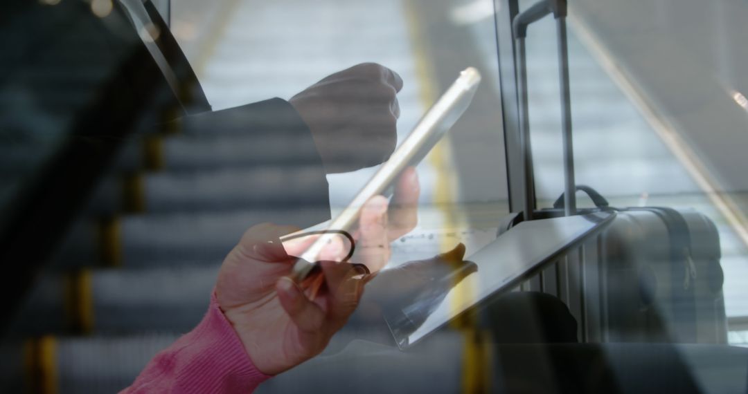 Business Professional Multitasking on Commute Using Tablet and Smartphone