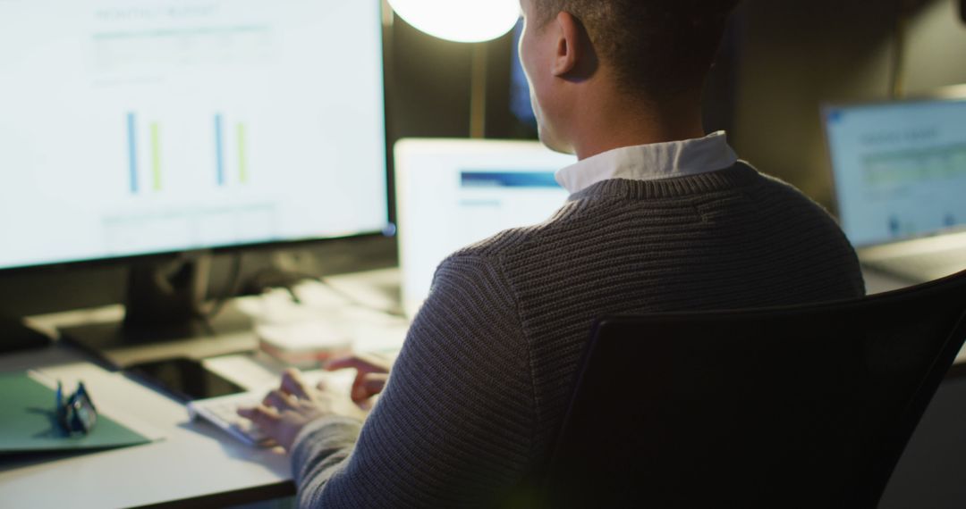 Professional Working Late in Office on Computer