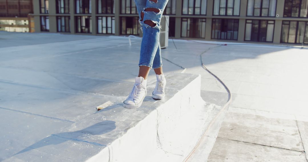 Urban Skateboard Culture with Ripped Jeans on Ramp - Free Images, Stock Photos and Pictures on Pikwizard.com