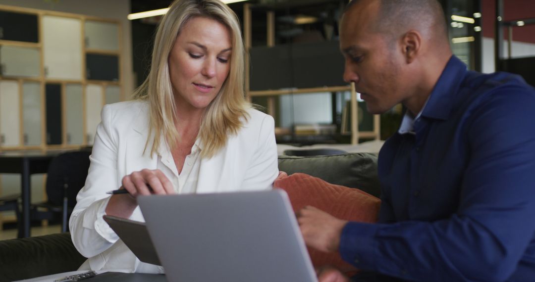 Diverse Colleagues Collaborate in Modern Office Meeting