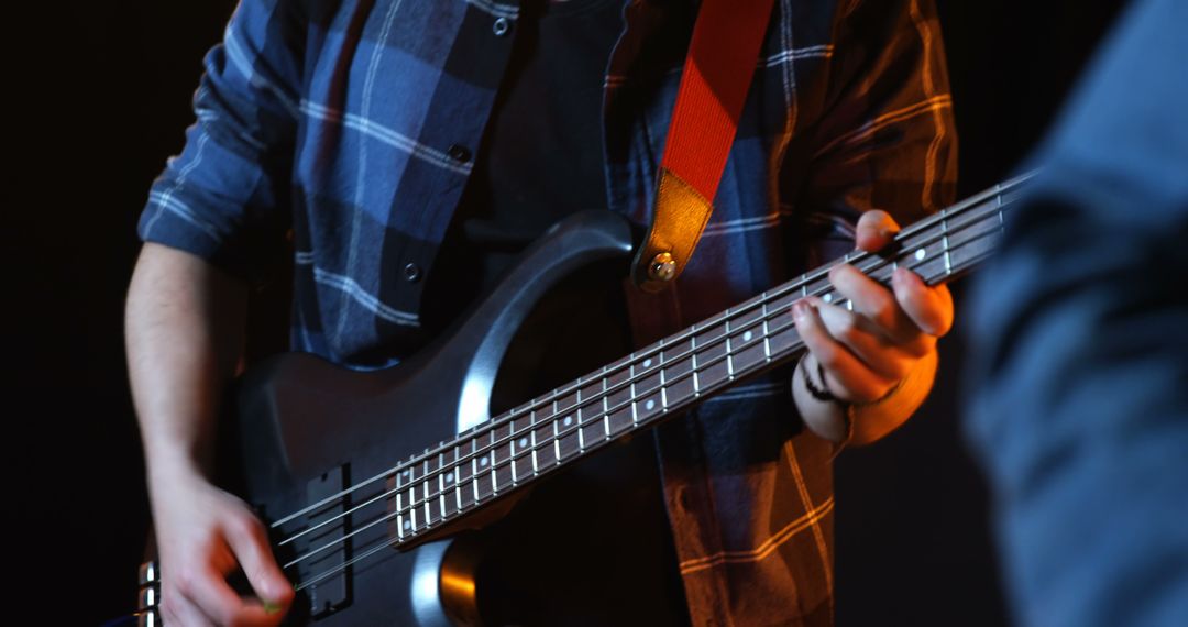 Close-up of Musician Playing Electric Bass Guitar at Live Concert - Free Images, Stock Photos and Pictures on Pikwizard.com