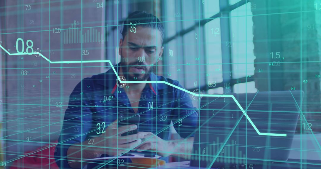 Sales Data Overlaying Focused Businessman Using Smartphone in Modern Office