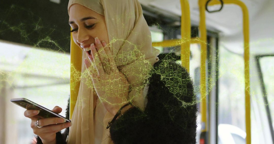 Smiling Woman with Hijab Enjoying Smartphone on Bus