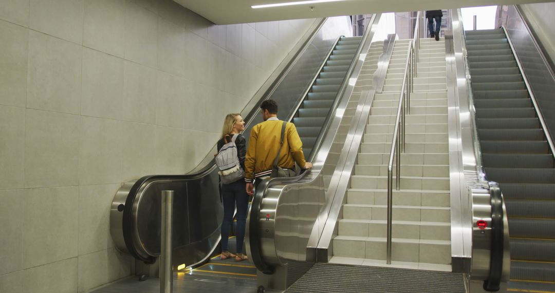 Caucasian Couple on Escalator Leaving Metro Station