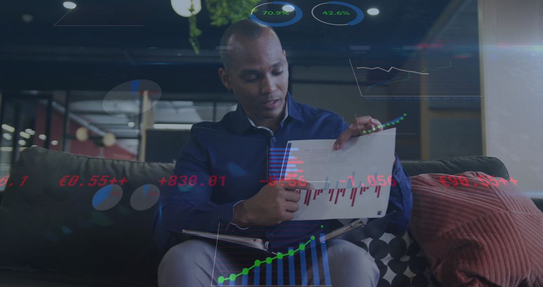 Businessman Analyzing Financial Data with Digital Technology Interface