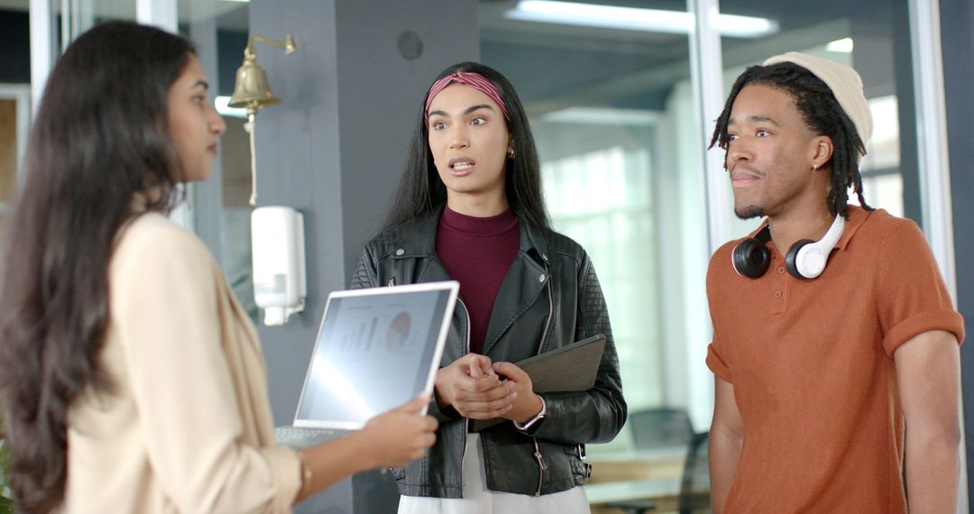 Young Diverse Team Collaborating, Presenting Data in Modern Office Brainstorming Meeting