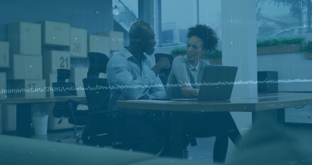 Coworkers Collaborating Over Laptop in Open Office with Waveform Data Visualization Overlay