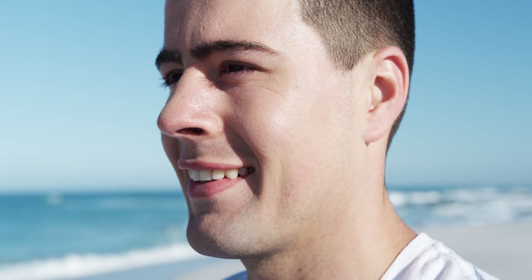 Close-up of Smiling Man at Beach - Free Images, Stock Photos and Pictures on Pikwizard.com