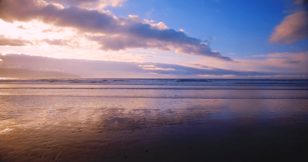 Tranquil Beach Sunset with Transparent Clouds