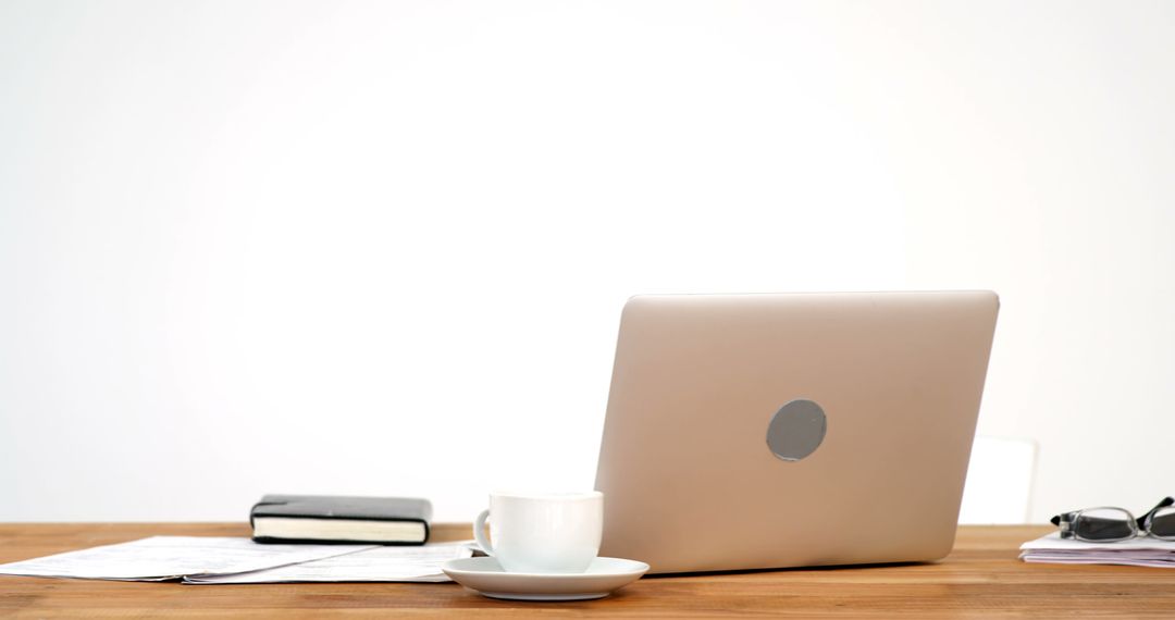 Minimalist Workspace with Open Laptop and Coffee Cup on Wooden Desk - Free Images, Stock Photos and Pictures on Pikwizard.com