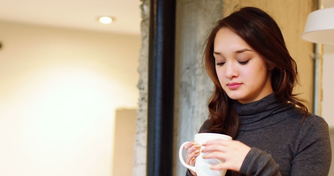 Woman Drinking Coffee in Cozy Indoor Space - Free Images, Stock Photos and Pictures on Pikwizard.com