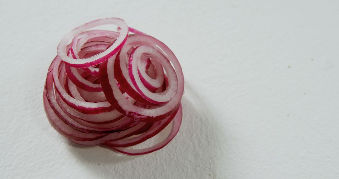 Close-up of Freshly Sliced Red Onion Rings on White Background - Free Images, Stock Photos and Pictures on Pikwizard.com