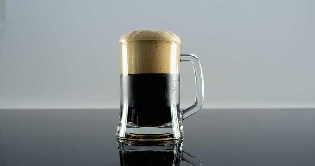 Glass Mug Filled with Dark Stout Beer with Frothy Head - Free Images, Stock Photos and Pictures on Pikwizard.com