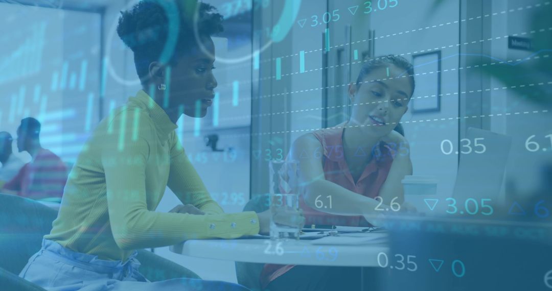 Analyzing financial data overlay during collaborative meeting in modern office lounge space