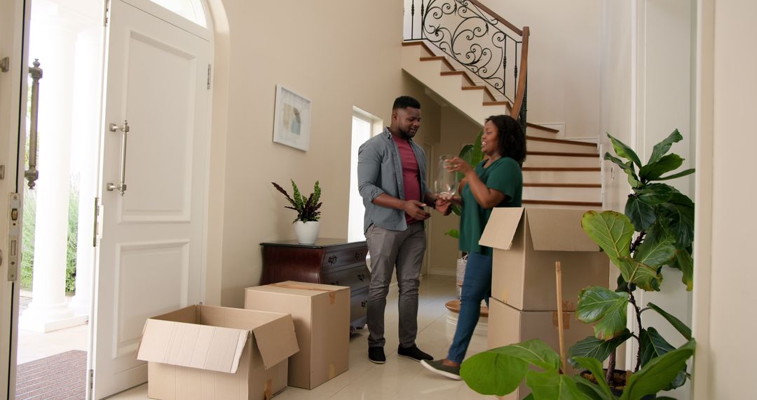 Joyful Couple Unpacking in New Home