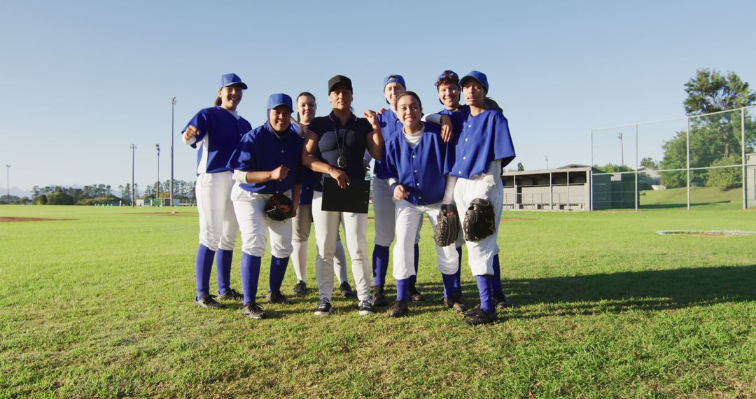 Smiling Youth Baseball Team with Coach on Field - Free Images, Stock Photos and Pictures on Pikwizard.com