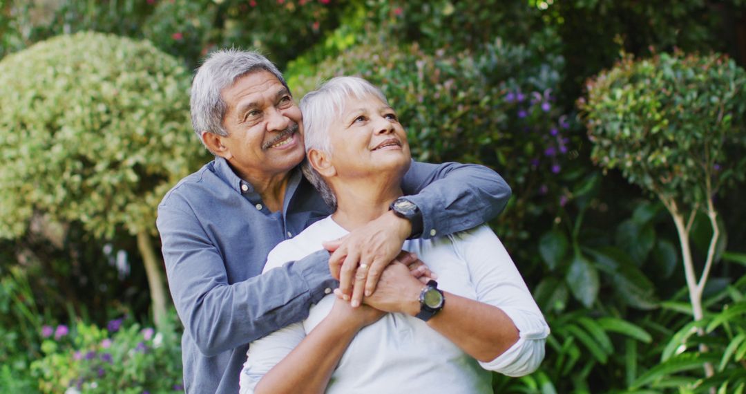 Image of happy biracial senior couple embracing in garden - Free Images, Stock Photos and Pictures on Pikwizard.com