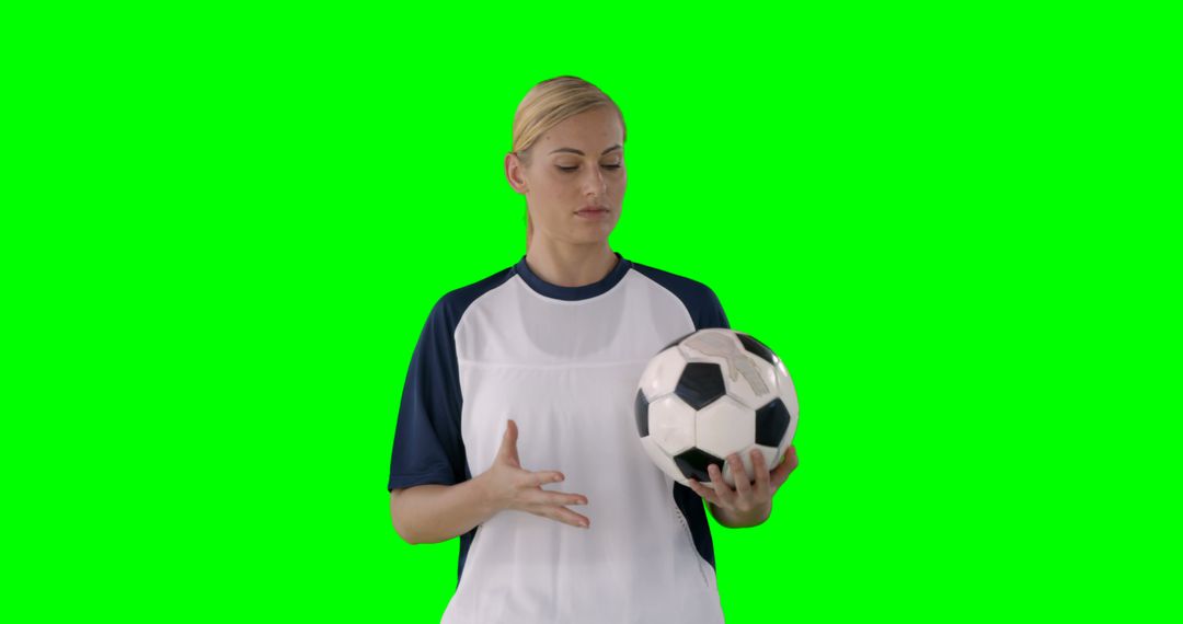 Female Athlete in Soccer Uniform Holding Ball against Green Screen - Free Images, Stock Photos and Pictures on Pikwizard.com