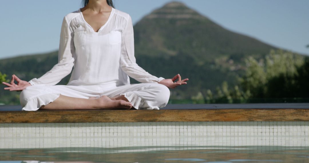 Woman Practicing Yoga by Pool with Mountain Background - Free Images, Stock Photos and Pictures on Pikwizard.com