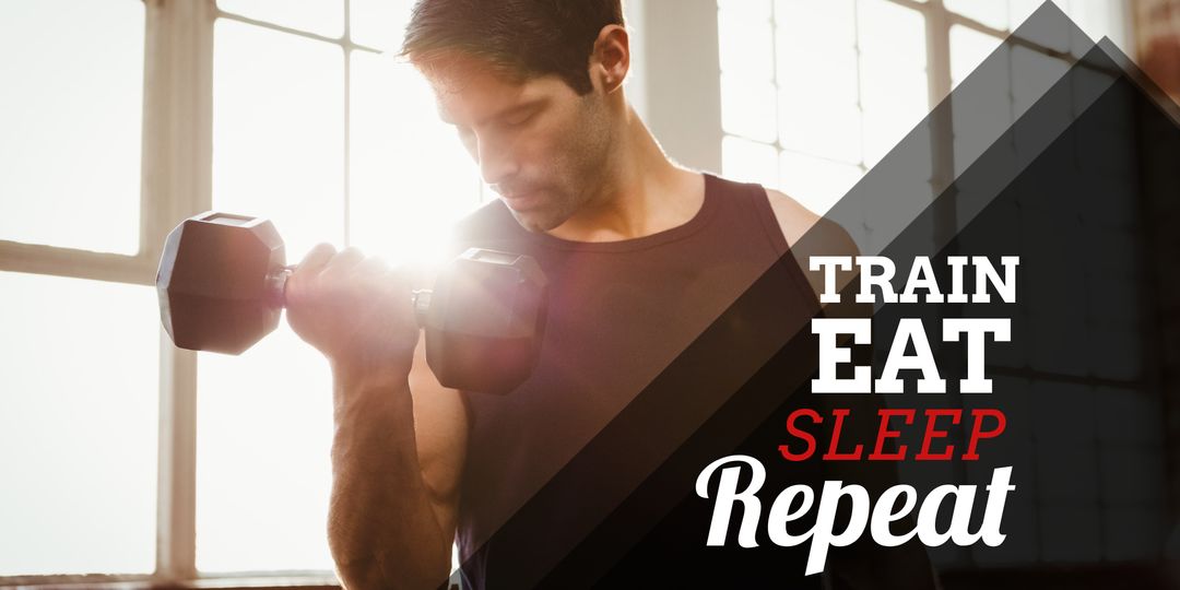 Determined Man Lifting Weights in Sunlit Gym