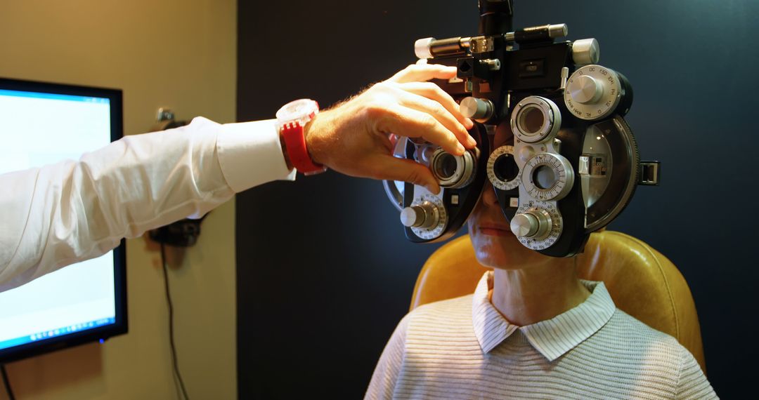 Patient Undergoing Eye Exam using Phoropter in Optometrist Office - Free Images, Stock Photos and Pictures on Pikwizard.com